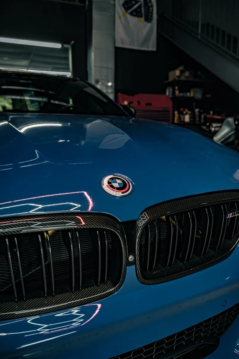 Close-up of a wrapped emblem after chrome delete