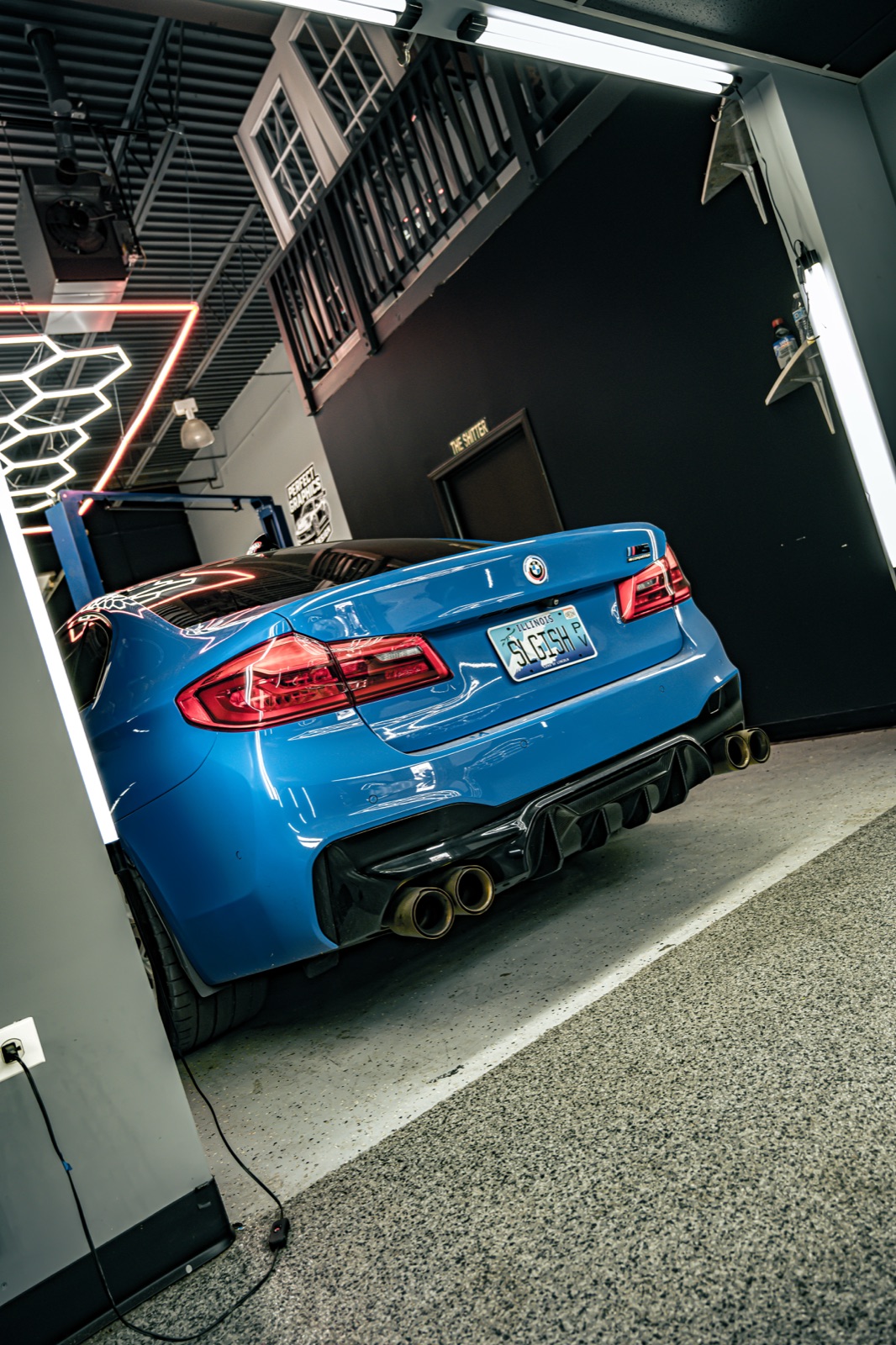 Blue BMW rear view in studio