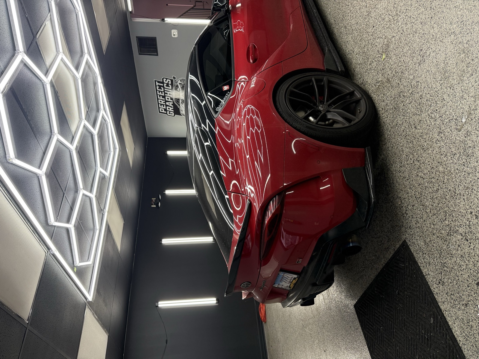 Candy red Toyota Supra color-change wrap in the Perfect Graphics studio