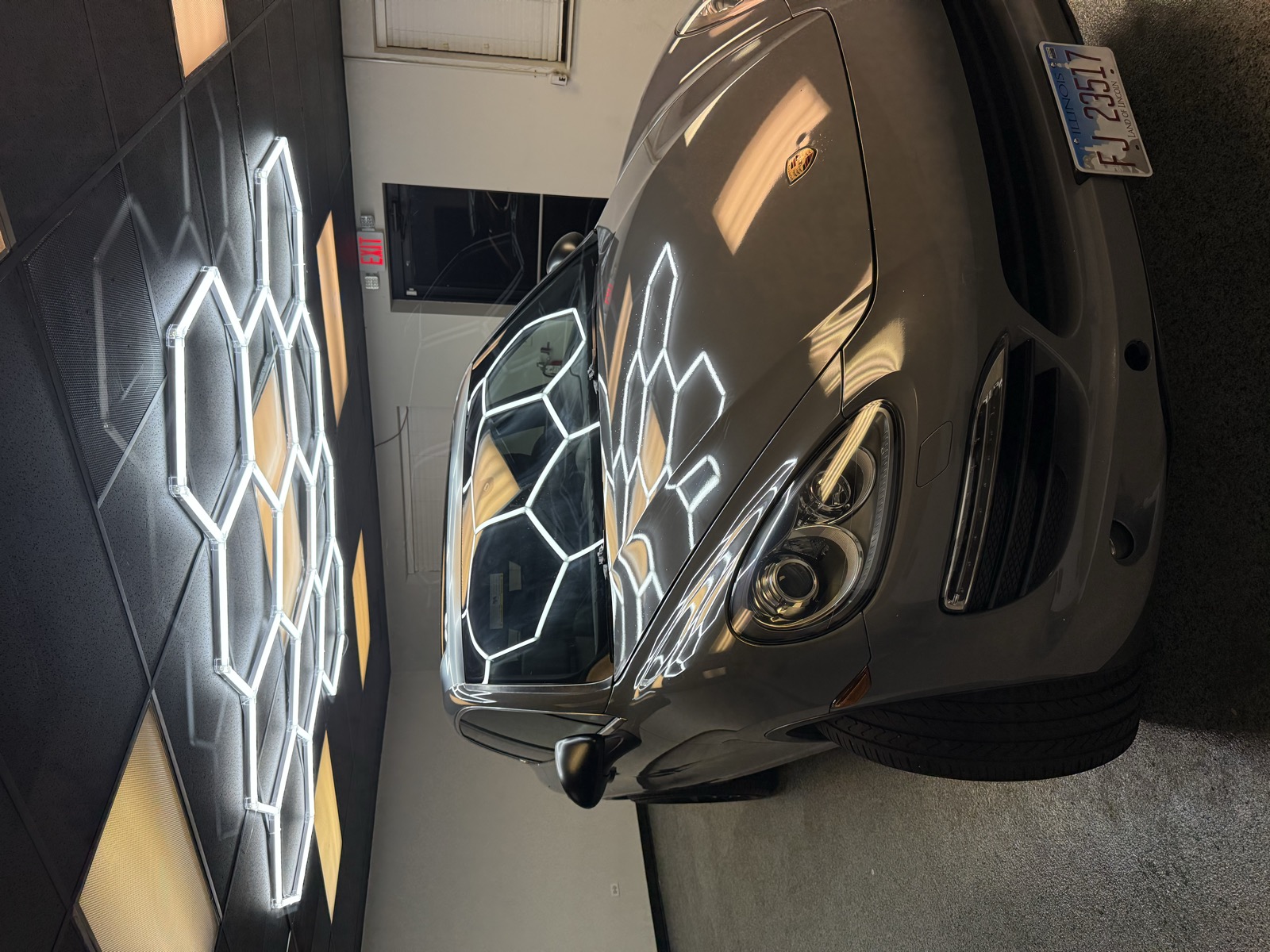 Porsche Cayenne gray wrap — front three-quarter