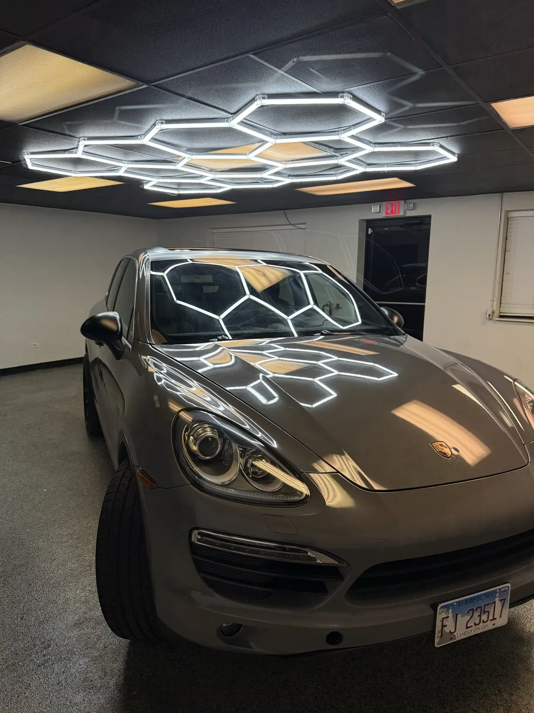 Porsche Cayenne gray wrap, front three-quarter