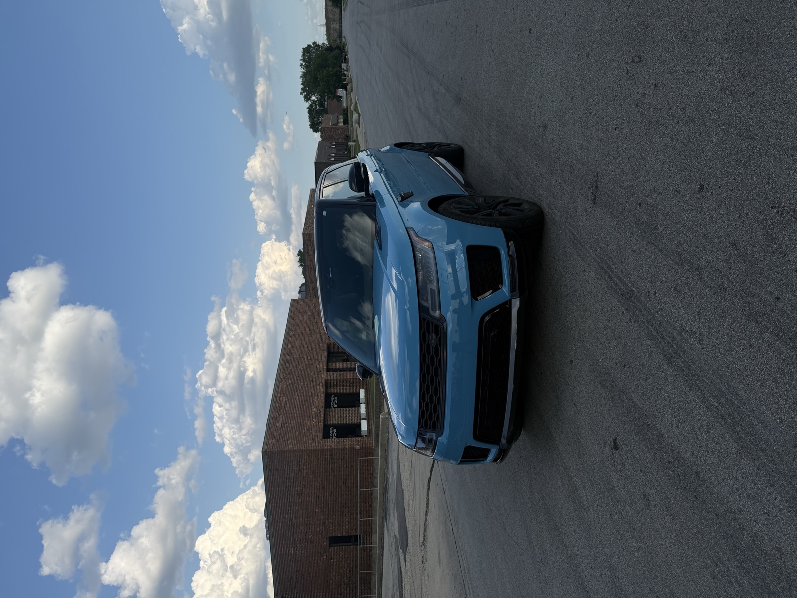 Range Rover Sport baby blue wrap — front three-quarter