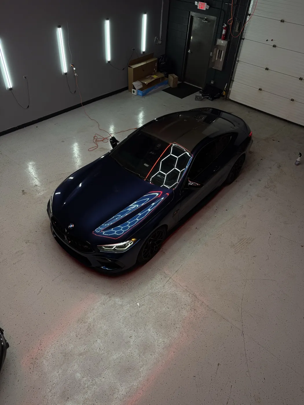 Blue BMW M8 with ceramic window tint installed at Perfect Graphics in Cary, IL