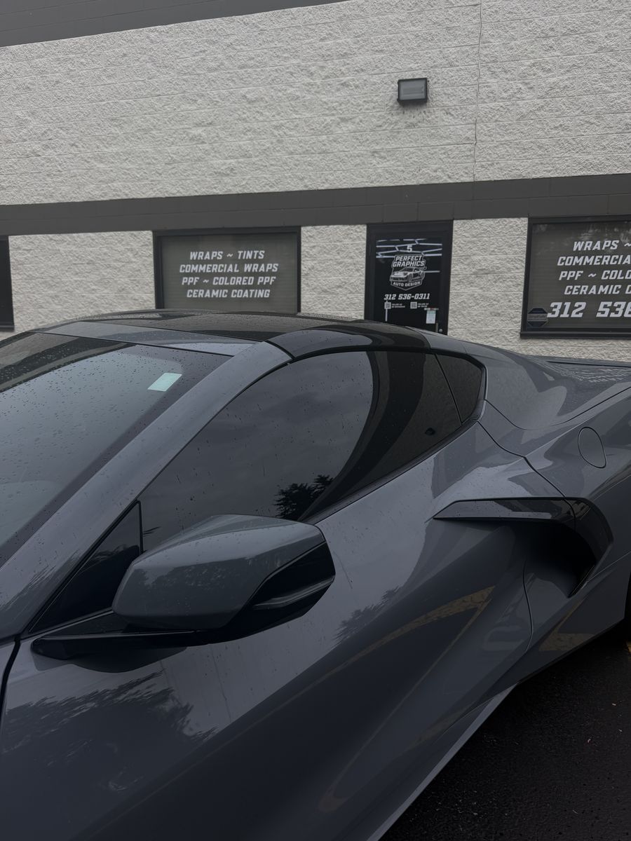 Chevrolet Corvette with tinted windows, side profile outside the shop