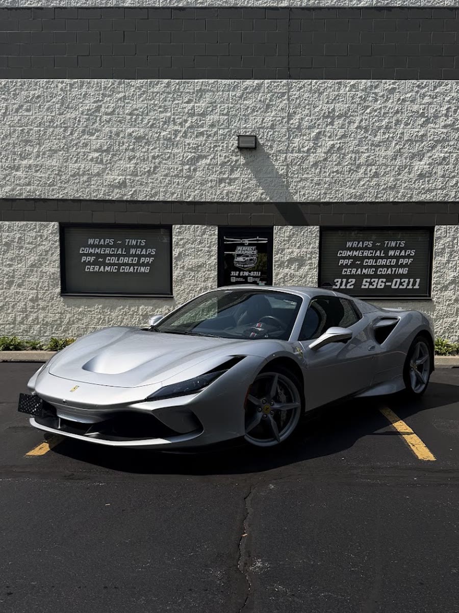 Silver Ferrari F8 after a full front paint protection film install, parked outside the Perfect Graphics shop in Cary