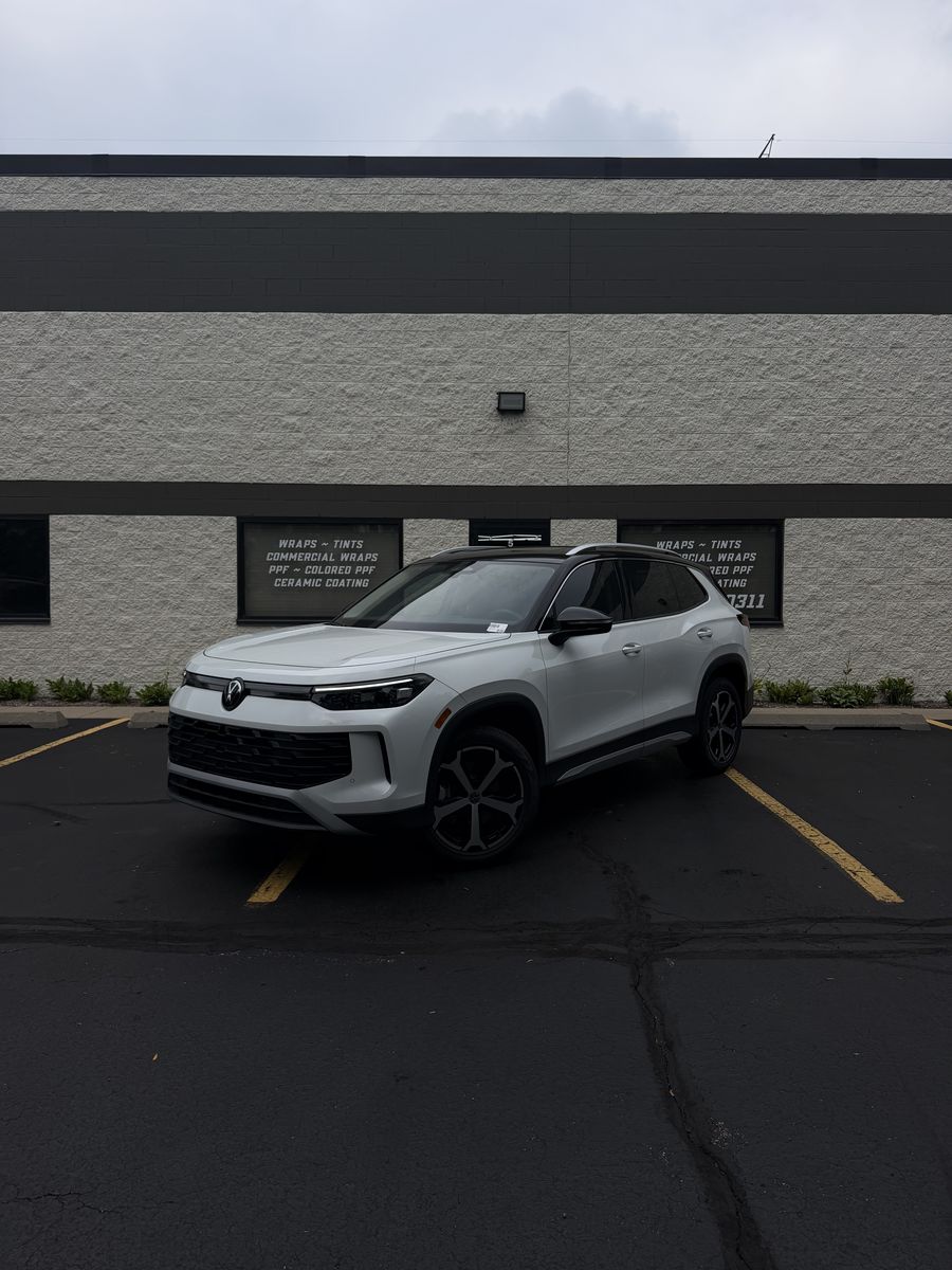 White SUV parked outside the Perfect Graphics shop in Cary, Illinois