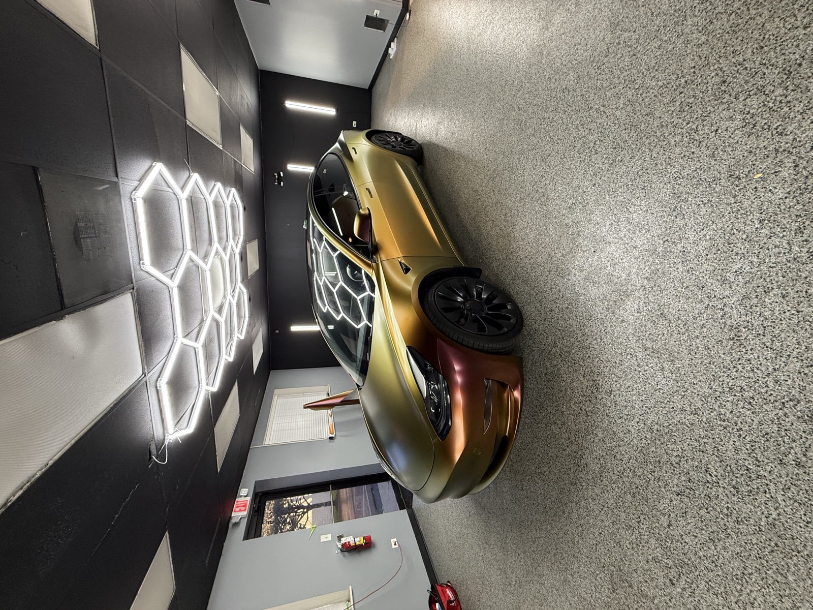 Gold color-shift wrapped Tesla Model 3 by Perfect Graphics in Cary, IL