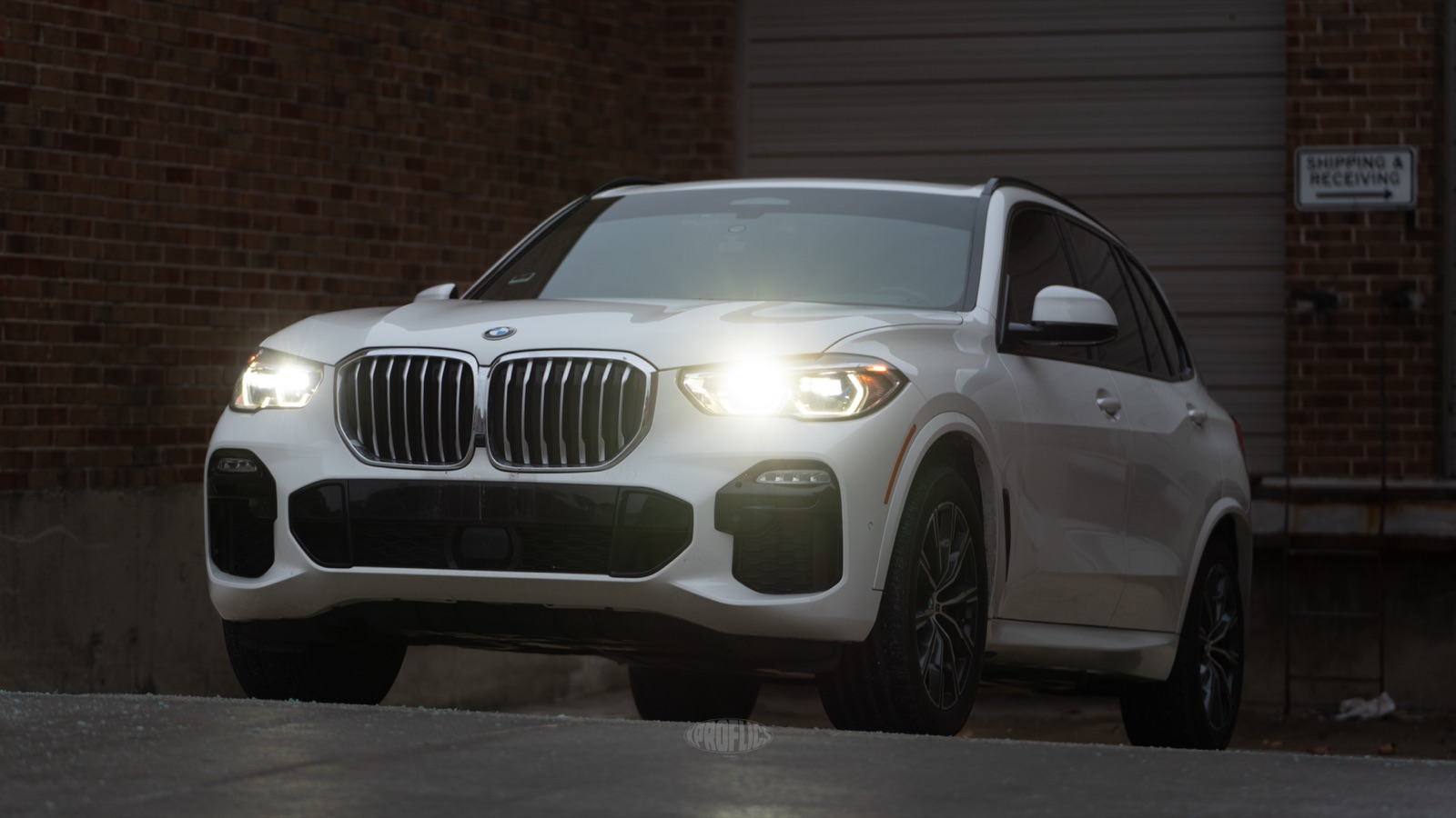 Glossy white BMW X5 protected with paint protection film